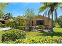 Beautiful single-story home with decorative stone, landscaping, and a well-manicured lawn at 800 Ebb Tide Ln, Kissimmee, FL 34759