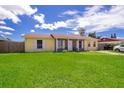 Ranch-style home with a spacious lawn and driveway at 6655 Durango Ct, Orlando, FL 32809
