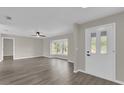 Bright living room featuring wood-look floors and a bay window at 10842 Sw 67Th Ave, Ocala, FL 34476