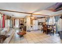 Cozy living space open to the kitchen, featuring tile floors and ample natural light at 221 Se 125Th Terrace Rd, Silver Springs, FL 34488
