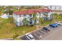 Apartment building near a pond with parking in front at 3714 Palm Desert Ln # 5317, Orlando, FL 32839
