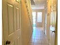 Clean entryway with tiled floors and staircase at 5123 Picadilly Circus Ct # 2, Orlando, FL 32839