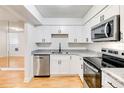 Modern kitchen with stainless steel appliances, shaker cabinets, and granite countertops at 542 Orange Dr # 22, Altamonte Springs, FL 32701