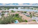 Aerial view of a community with lake, pool, and parking at 570 Orange Dr # 54, Altamonte Springs, FL 32701