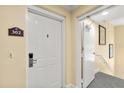 Apartment building entry door and hallway at 7703 Heritage Crossing Way # 302, Reunion, FL 34747