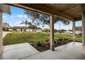 View from the front porch showing the meticulously landscaped yard and the friendly neighborhood at 10339 Castillo Ct, Clermont, FL 34711