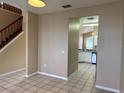 View into kitchen from dining area, white cabinets at 16946 Woodcrest Way, Clermont, FL 34714