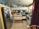Kitchen features stainless steel appliances and white cabinets at 2864 Copper Ridge Ct, Lake Mary, FL 32746