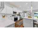 Modern kitchen with stainless steel appliances and white cabinets at 3119 Kendal Way, Lakeland, FL 33813