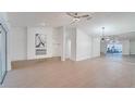 Bright living room featuring hardwood floors, a fireplace, and large windows at 5019 Nassau Cir # 5, Orlando, FL 32808
