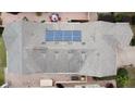 Top-down view of house showcasing solar panels on the roof at 111 Bayou Bend Rd, Groveland, FL 34736