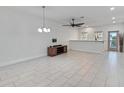 Bright dining room with tile floors and modern chandelier at 13444 Stoddart Ave, Orlando, FL 32827