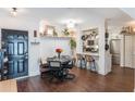 Modern white kitchen with stainless steel appliances and breakfast bar at 206 E South St # 6031, Orlando, FL 32801
