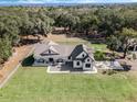 A bird's eye view of a house on a large lot with lush green grass at 2850 Horton Rd, Kissimmee, FL 34744