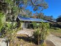 House exterior with blue roof and landscaping at 3421 Fudge Rd, Apopka, FL 32712