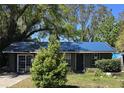 Cozy single-story home with a well-maintained lawn and mature trees, offering a comfortable and inviting curb appeal at 3421 Fudge Rd, Apopka, FL 32712