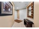 Bright entryway with tile floors and built-in bench at 3799 S Atlantic Ave # 602, Daytona Beach, FL 32118