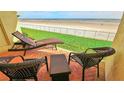 Enjoy breathtaking ocean views from this relaxing patio area at 4153 S Atlantic Ave # 1030, New Smyrna Beach, FL 32169