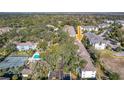 Aerial view showing condo building, pool, and tennis court at 4208 Clubside Dr # 4208, Longwood, FL 32779