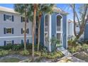 Condo building exterior showcasing blue accents and landscaping at 4208 Clubside Dr # 4208, Longwood, FL 32779