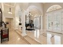 Grand entry with high ceilings, marble floors, and a piano at 6220 Cartmel Ln, Windermere, FL 34786
