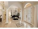 Grand entry with high ceilings, marble floors, and a piano at 6220 Cartmel Ln, Windermere, FL 34786