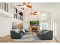 Spacious living room with fireplace, high ceilings, and comfortable seating at 749 Silver Birch Pl, Longwood, FL 32750