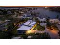 Luxury waterfront home with modern design, pool, and beautifully landscaped grounds at 8968 Bay Cove Ct, Orlando, FL 32819