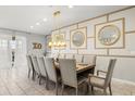 Elegant dining room featuring a large table with seating for ten and decorative wall accents at 1986 Summer Dr, Davenport, FL 33897