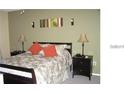 Main bedroom with a bed and nightstands at 2216 Grand Cayman Ct # 1415, Kissimmee, FL 34741