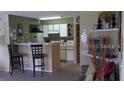 Kitchen with breakfast bar and appliances at 2216 Grand Cayman Ct # 1415, Kissimmee, FL 34741