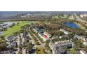 Aerial view of a townhome community near a golf course, highlighting property location at 264 Celebration Blvd # 264, Celebration, FL 34747