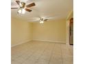 Bright living room with tile floors and ceiling fans at 4355 E Michigan St # 4355, Orlando, FL 32812