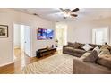 Spacious living room with sectional sofa and hardwood floors at 4833 Cypress Woods Dr # 4101, Orlando, FL 32811