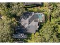 Aerial view showcasing home, pool, and backyard at 4847 Shoreline Cir, Sanford, FL 32771