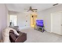 Spacious living room with wall-to-wall carpeting at 4897 Cypress Woods Dr # 6303, Orlando, FL 32811