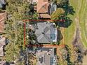 Property view showcasing the home's size and backyard at 6541 Fairway Hill Ct, Orlando, FL 32835