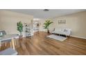 Bright living room with hardwood floors and comfy seating at 720 E Iris Dr, Orange City, FL 32763