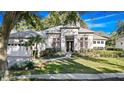 Stunning curb appeal of this single-Gathering home with lush landscaping at 837 Ashbrooke Ct, Lake Mary, FL 32746