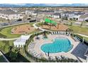 Community pool and playground aerial view at 1122 Seaside Mist Trl, Kissimmee, FL 34747