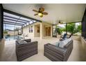 Relaxing screened-in pool area with patio furniture at 121 Whirlaway Dr, Davenport, FL 33837