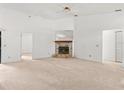 Living room with fireplace, neutral carpeting, and ceiling fan at 1360 Cherrybark Rd, Apopka, FL 32703