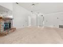 Living room with brick fireplace and neutral carpeting at 1360 Cherrybark Rd, Apopka, FL 32703