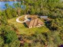 Single-Gathering home on a waterfront lot with circular driveway at 1851 Grand Keahl Ln, Deltona, FL 32738