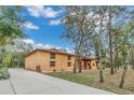 House with long driveway and mature trees at 3141 Oak Alley Dr, Apopka, FL 32703