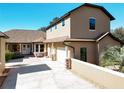 Elegant exterior view showcasing architectural details, lush landscaping and attached two car garage at 38207 Sabal Way, Umatilla, FL 32784