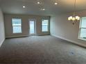 Spacious living room with neutral carpeting and plenty of natural light at 4586 Se 25Th Loop, Ocala, FL 34480