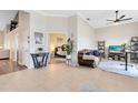 Open living area with a comfortable couch and a view of a bedroom at 623 Yorkshire Dr, Oviedo, FL 32765