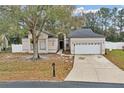 House exterior with a two-car garage and driveway at 752 Americana Ct, Kissimmee, FL 34758