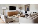 Spacious living room featuring a neutral color palette, plush sofas, and a large TV at 1830 Park Lake St, Orlando, FL 32803